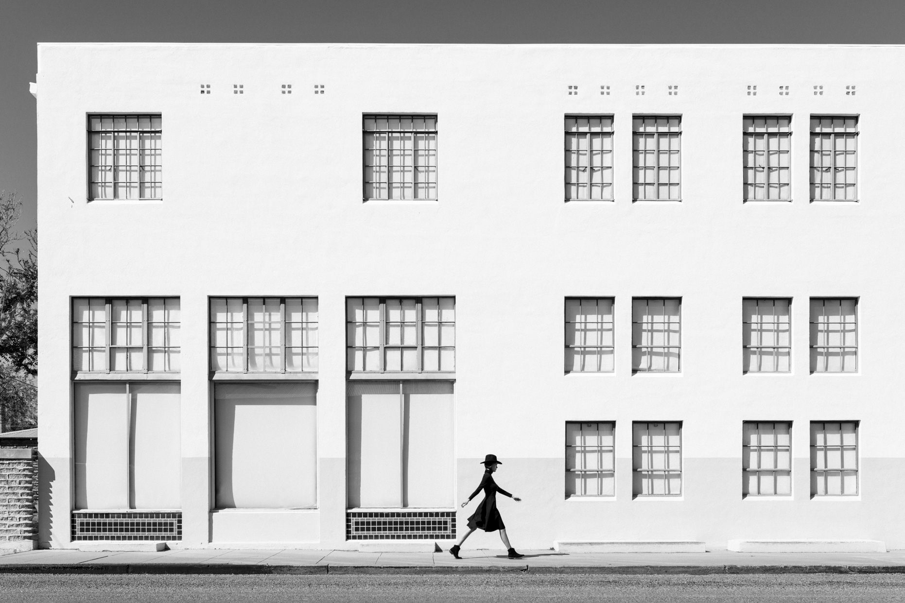 Kate Walking White Building